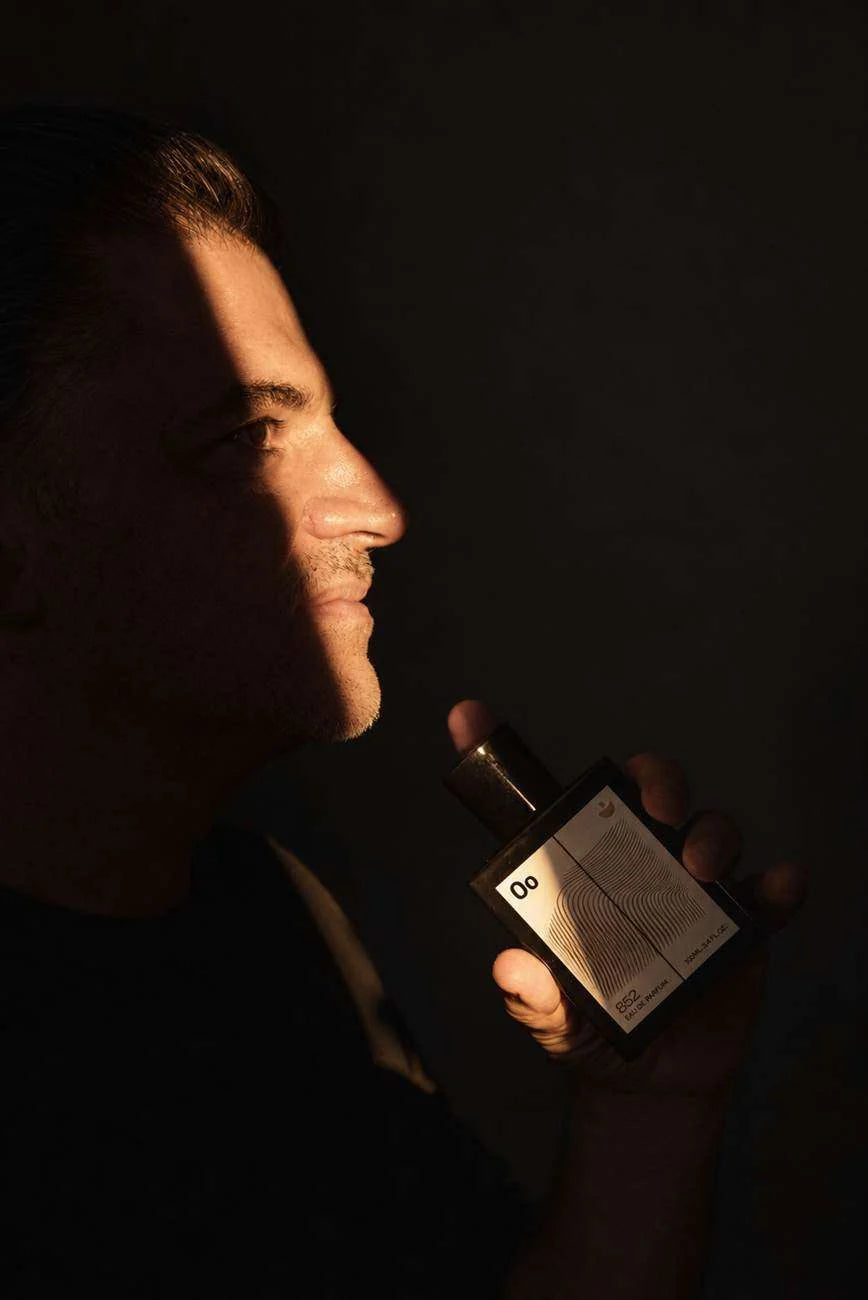 Original Dan Terry Frequency campaign portrait with a fragrance bottle