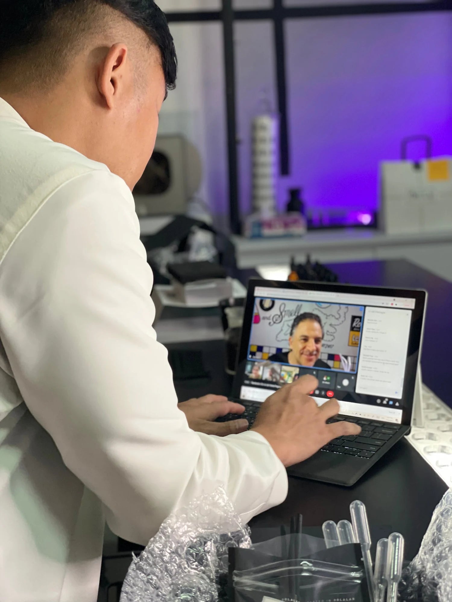 Oo La Lab host leading a fragrance workshop through a laptop
